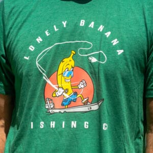 Person wearing green shirt with banana graphic.