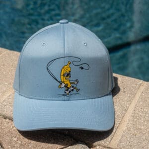 Blue cap with banana fishing cartoon design.