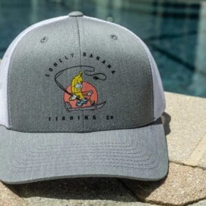 Gray cap with banana fishing logo.